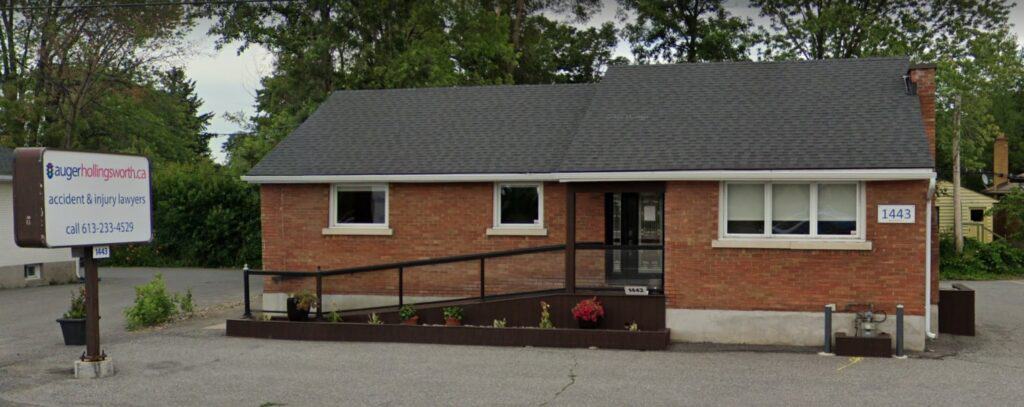 Picture of the Nepean office in the suburbs of Ottawa, a red brick building with a wheelchair accessibility ramp out front.